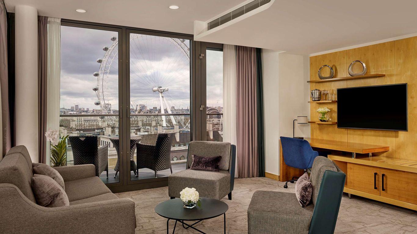Living room as part of a suite with balcony views of big ben