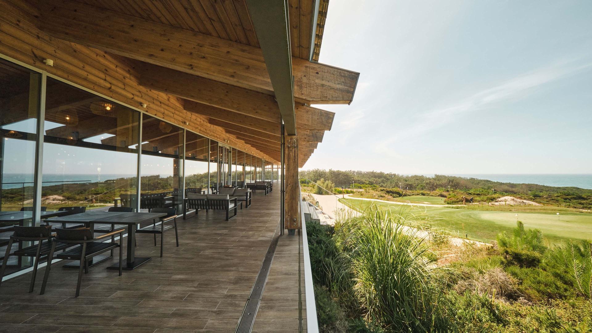 Outdoor dining with views of the course at Praia Rey West Cliffs