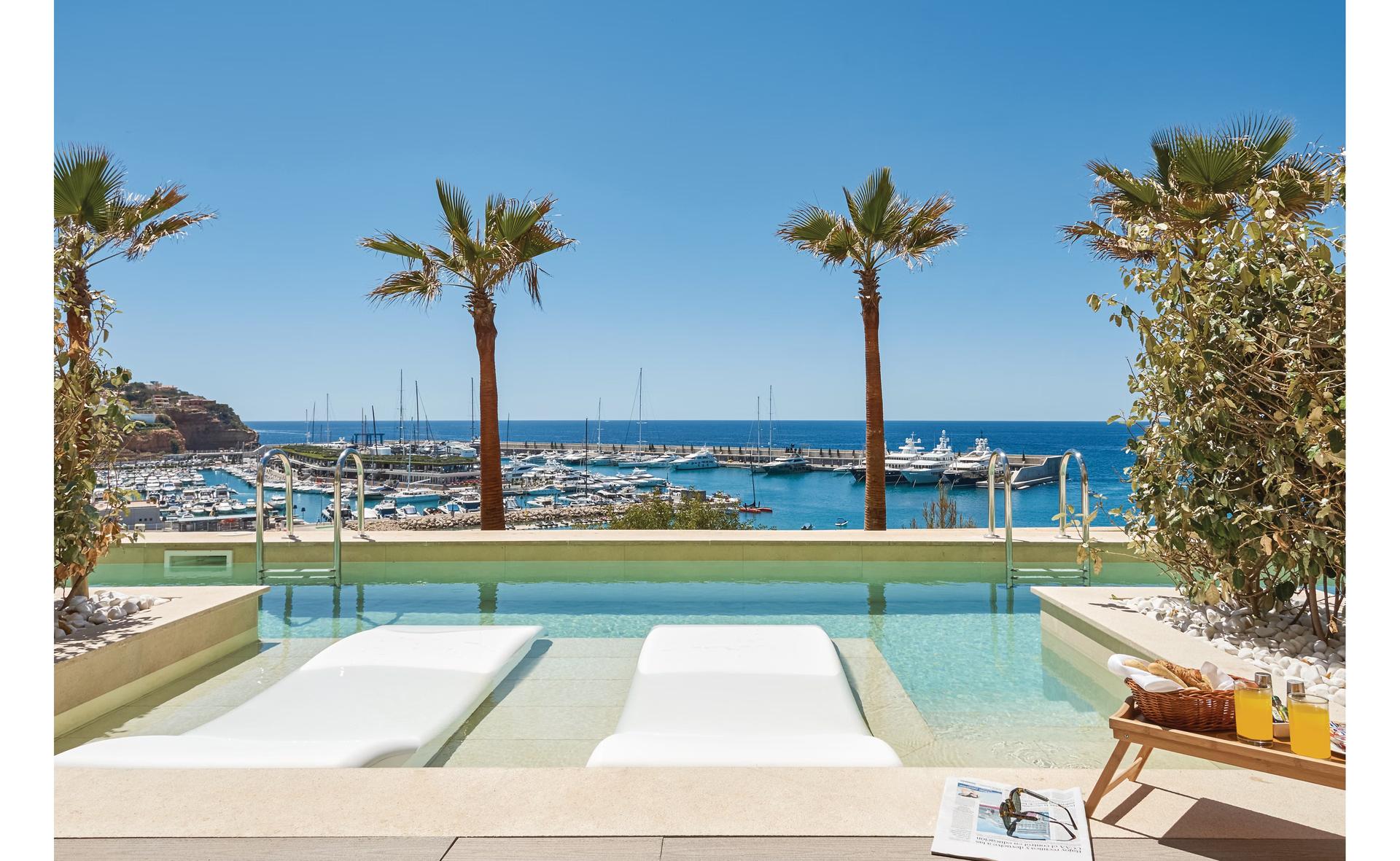 Outdoor swimming pool at Pure Salt Port Adriano with ocean views