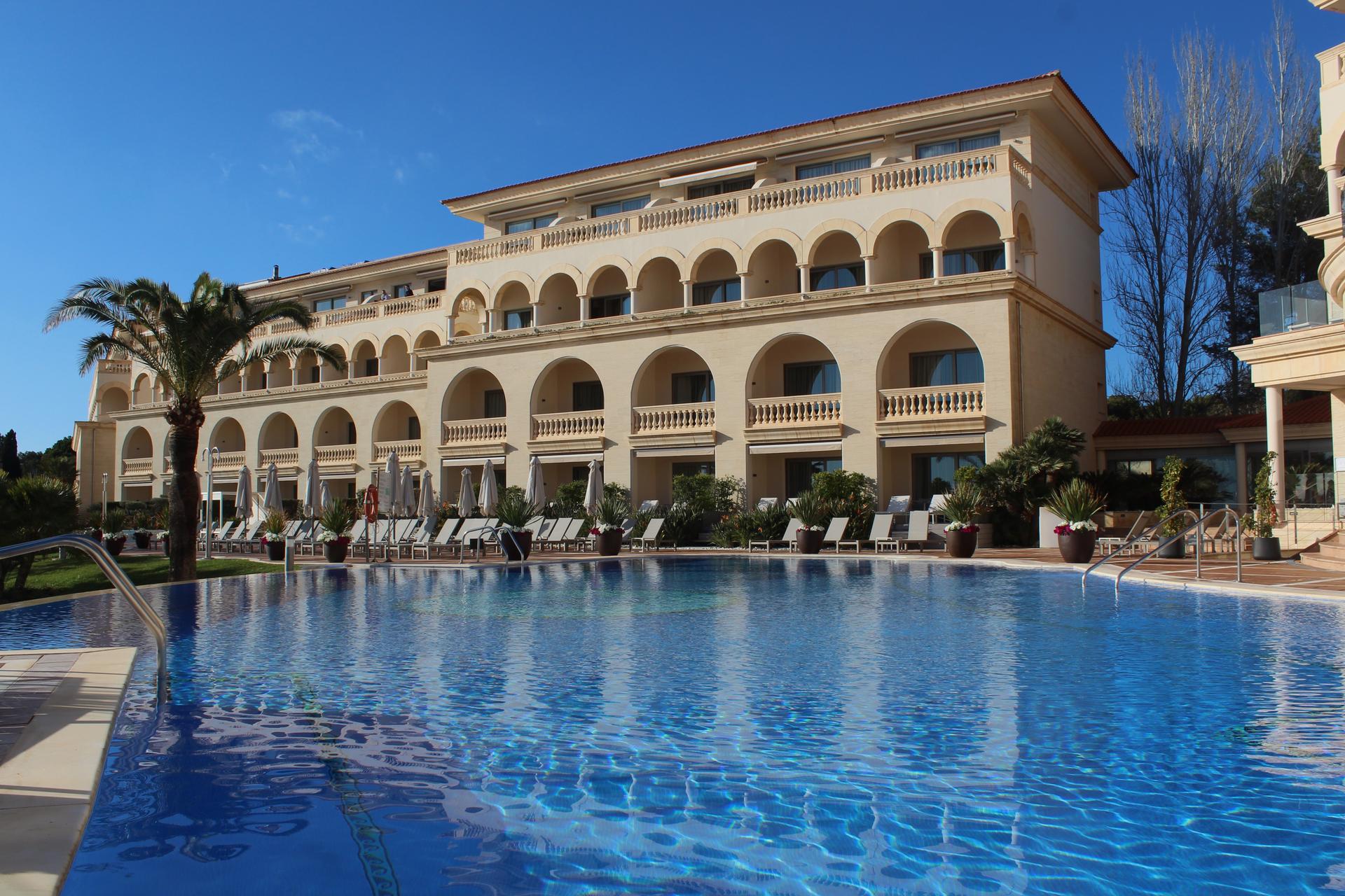 The Pure Salt Port Adriano building overlooking the outdoor pool