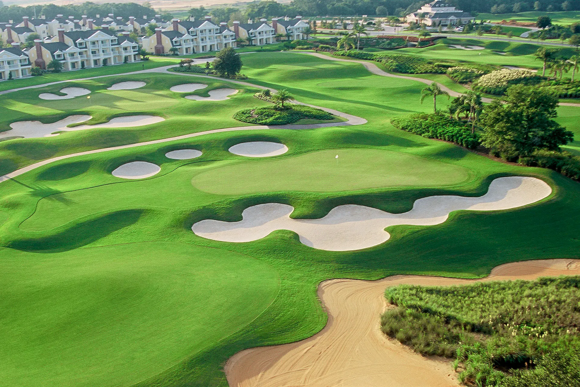 Overhead view of an elevated green surrounded by sand bunkers