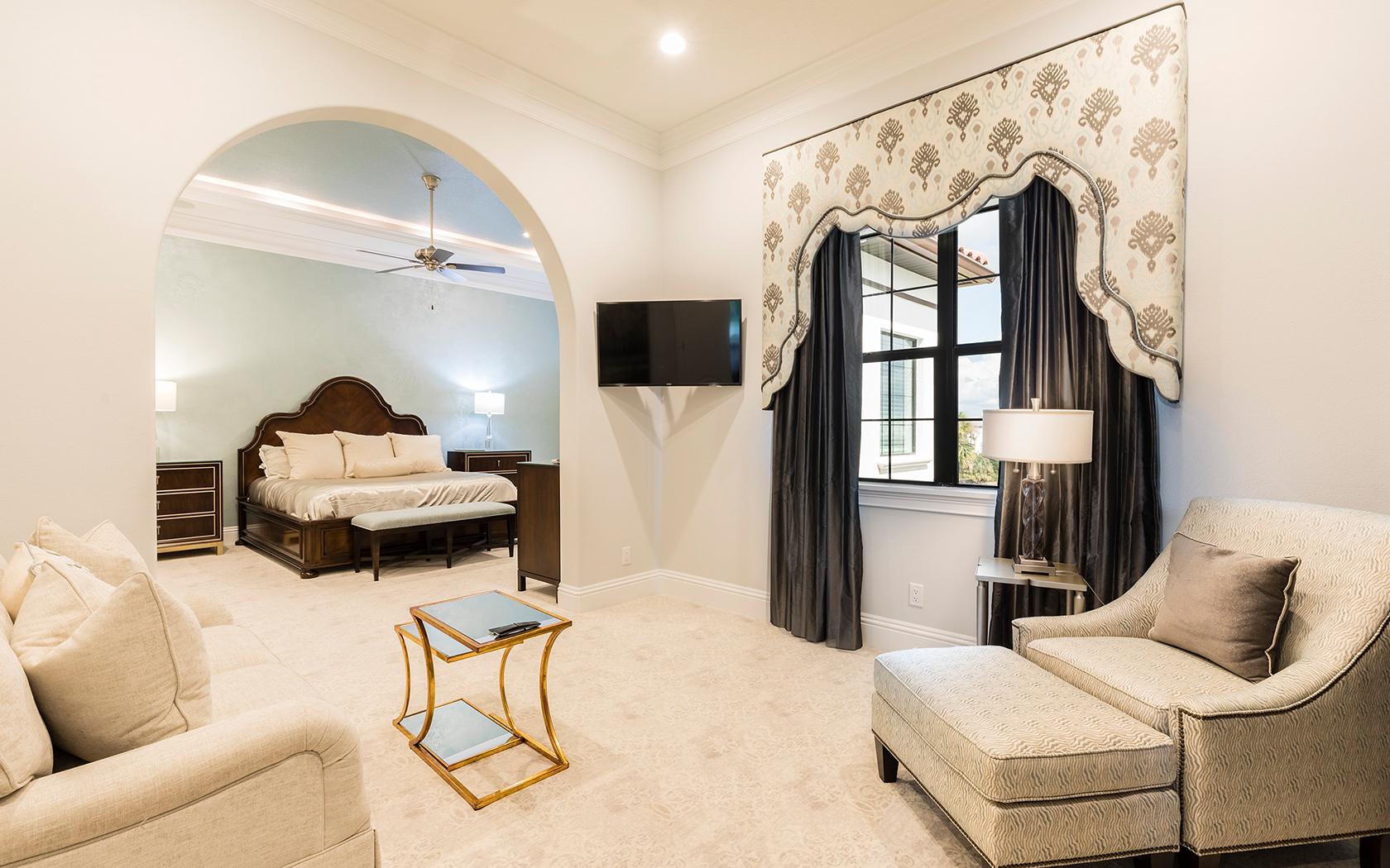 Lounging area leading to a double bed room at Reunion Resort