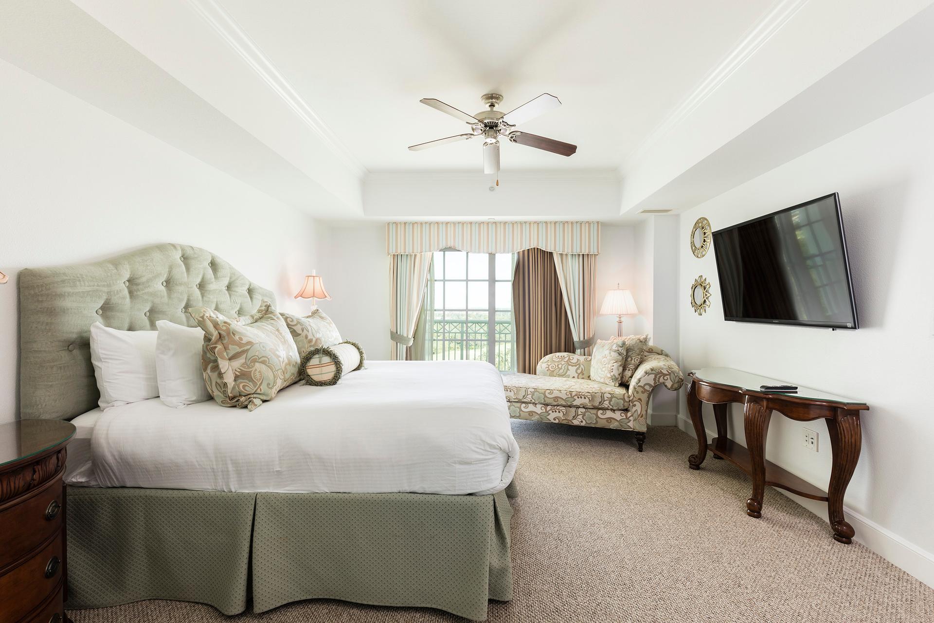 Double bed suite with a tv on the wall