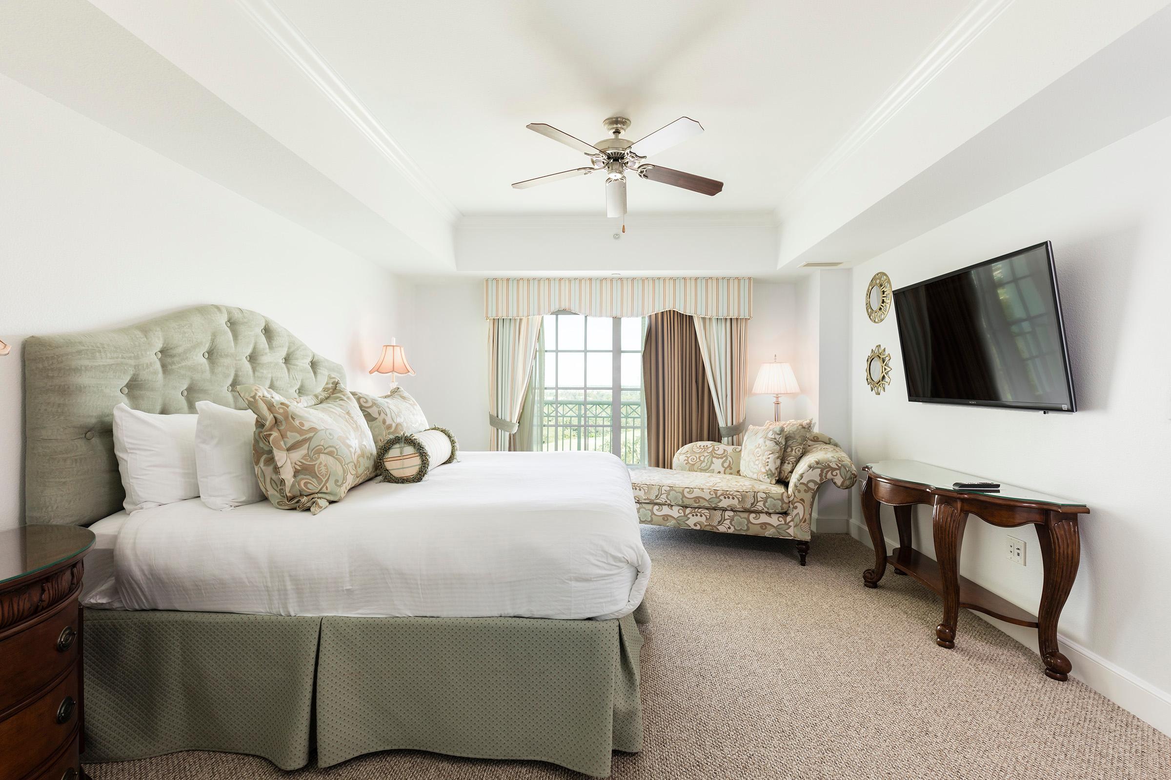 Double bed suite with a tv on the wall