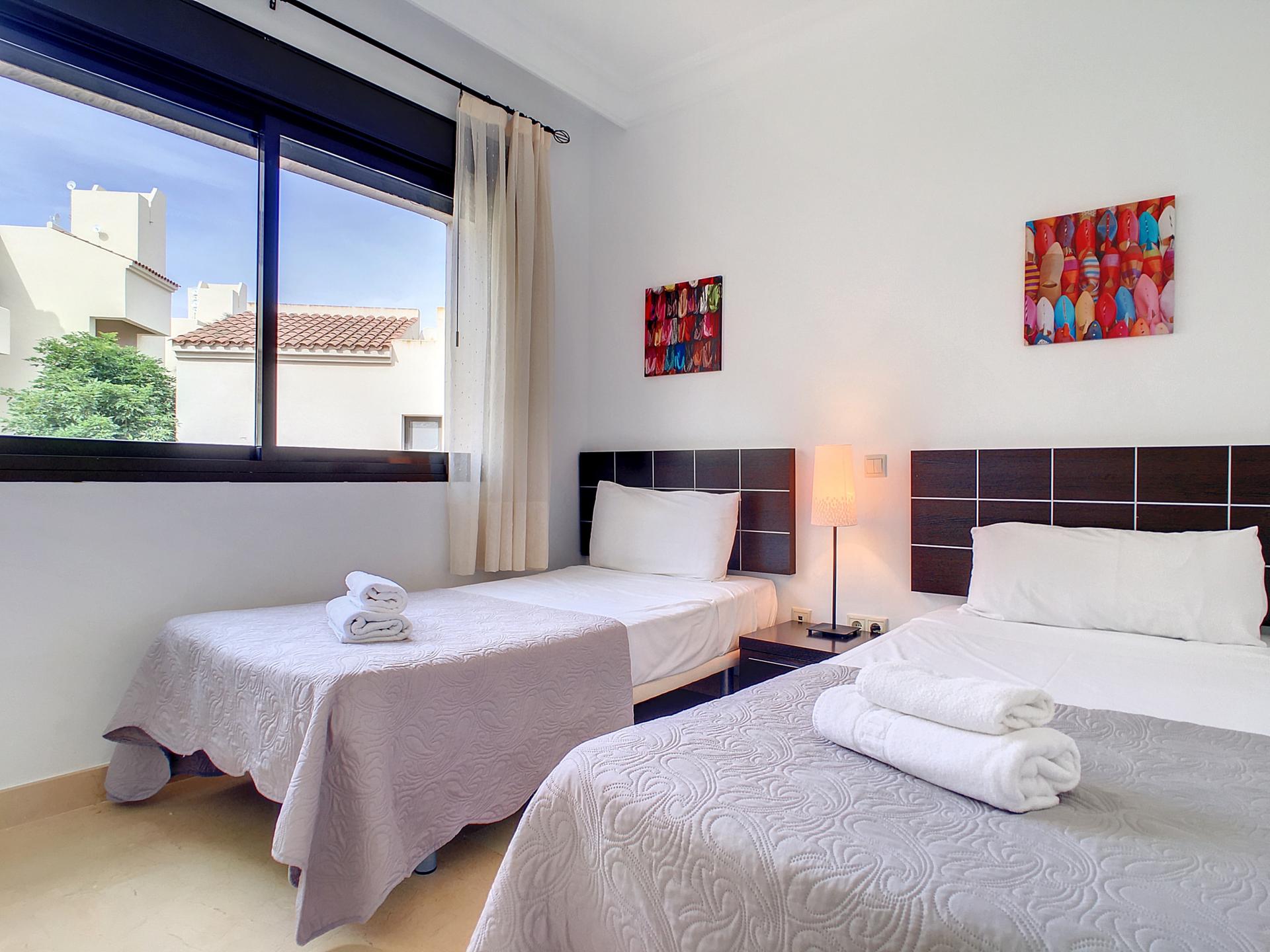 Twin bed room at the Roda Golf & Beach Resort