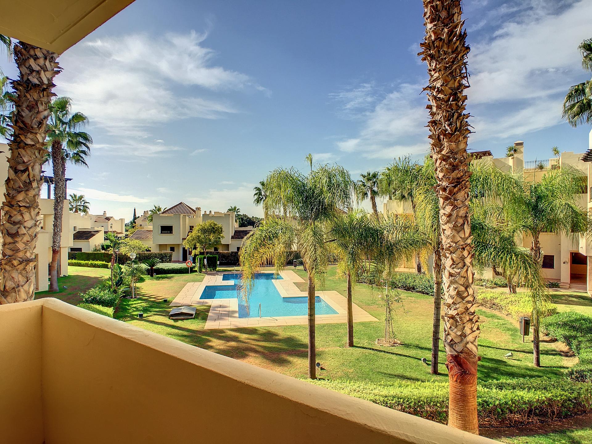 Balcony view of the outdoor pool area