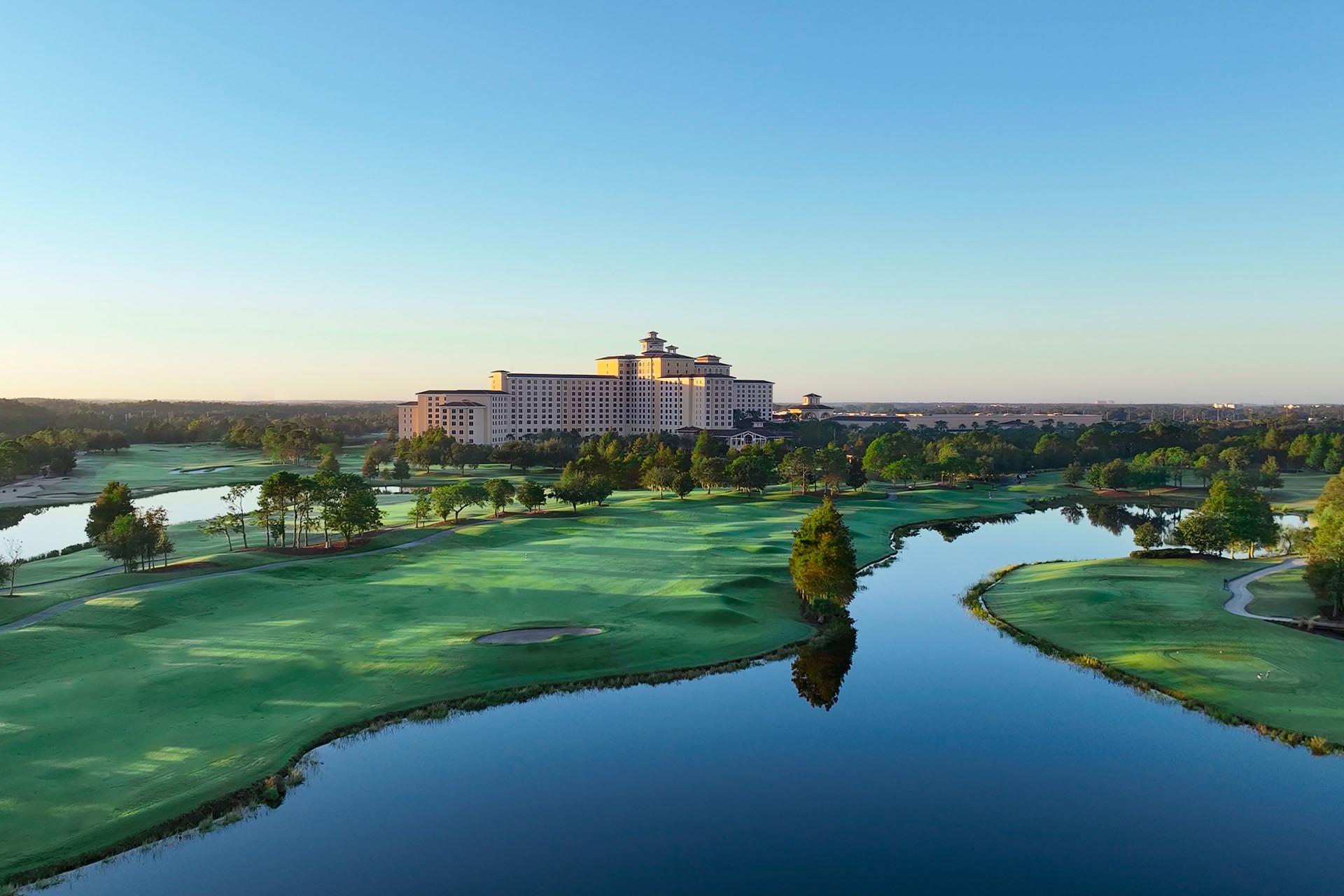 Panoramic view of a well maintained fairway next to a water hazard