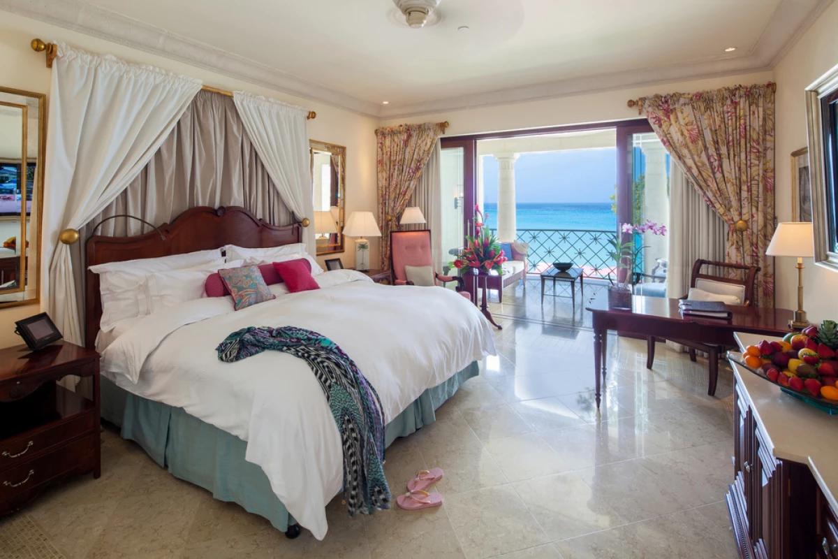 Double bed room at Sandy Lane with balcony views of the ocean