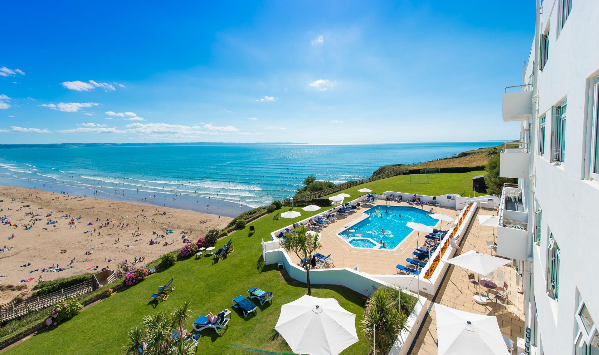 Overhead view of the outside swimming pool with beach views at Saunton Sands Hotel