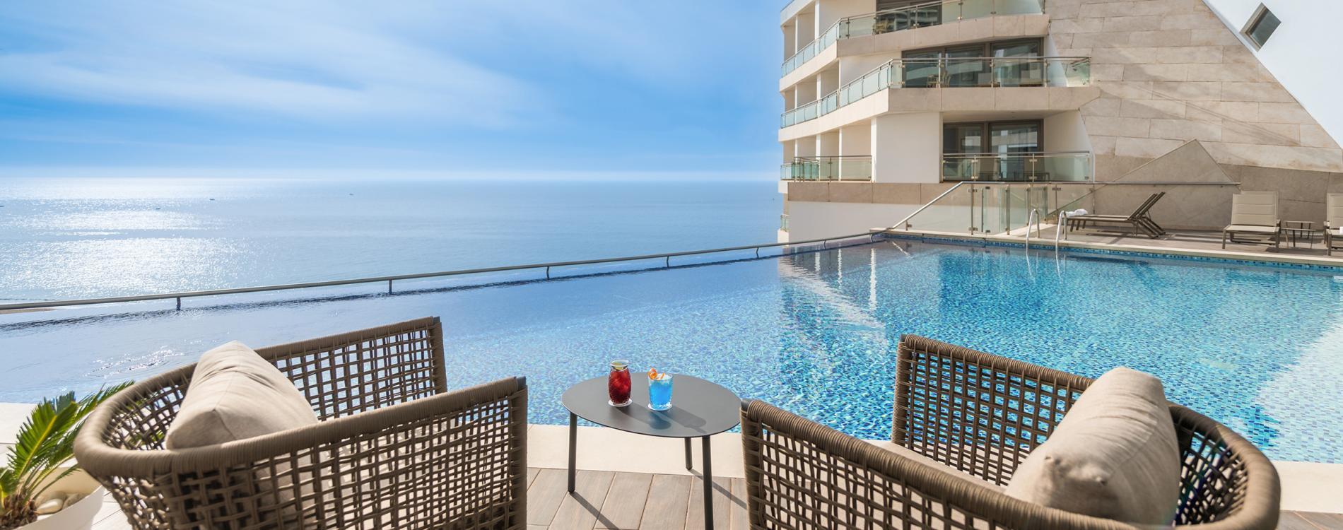 Poolside lounging area at the Sesimbra Oceanfront