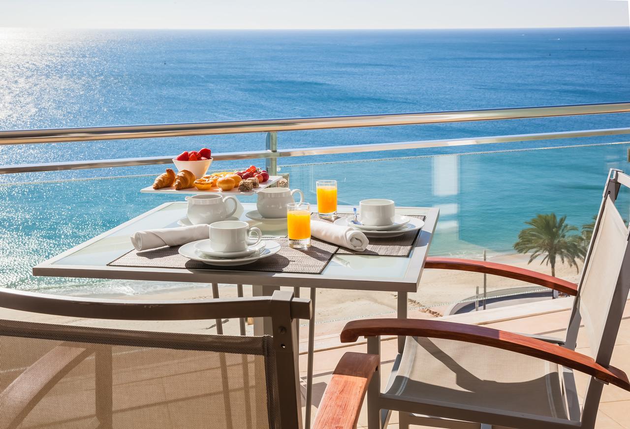 Dining table on a balcony with ocean views