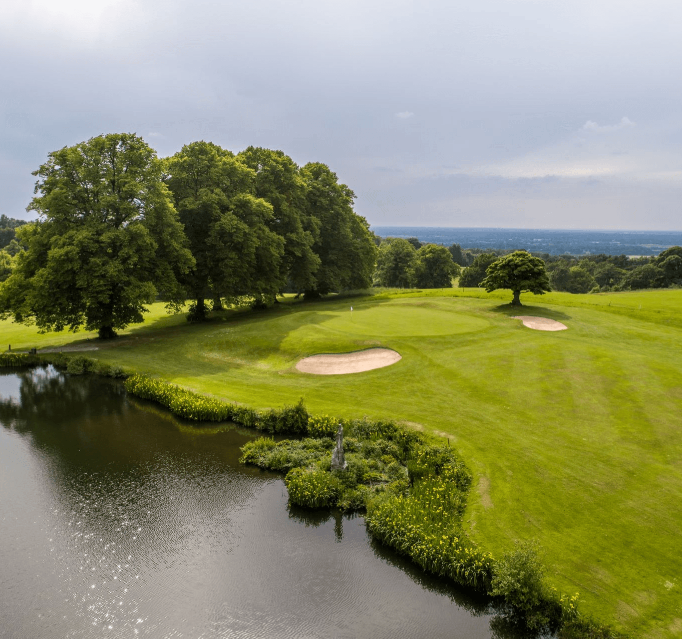 A well maintained fairway with sand bunkers