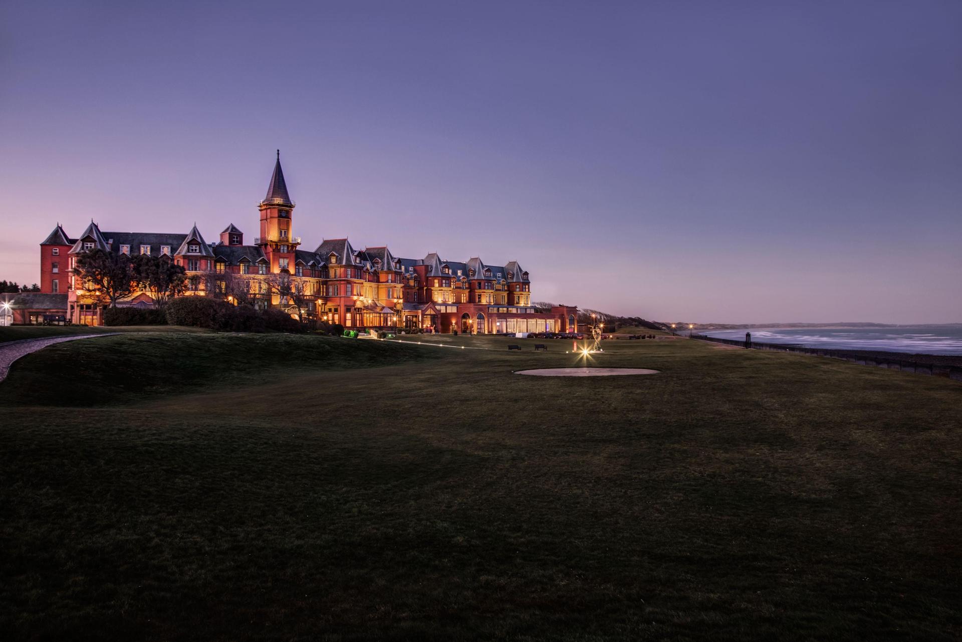 Panoramic view of the Slieve Donard Resort & Spa lit up at night time