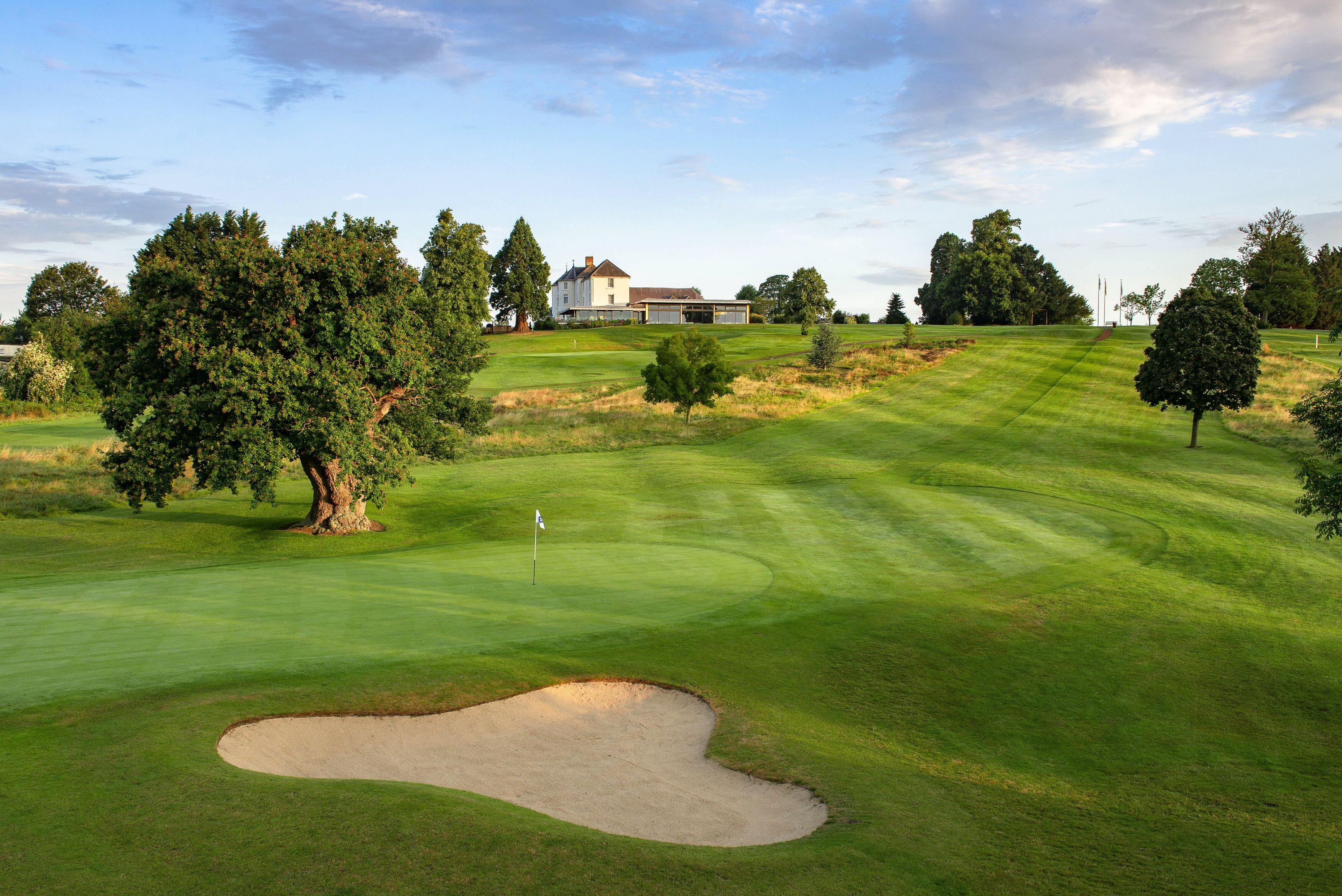A well maintained nestled with a sand bunker at Tewkesbury Park