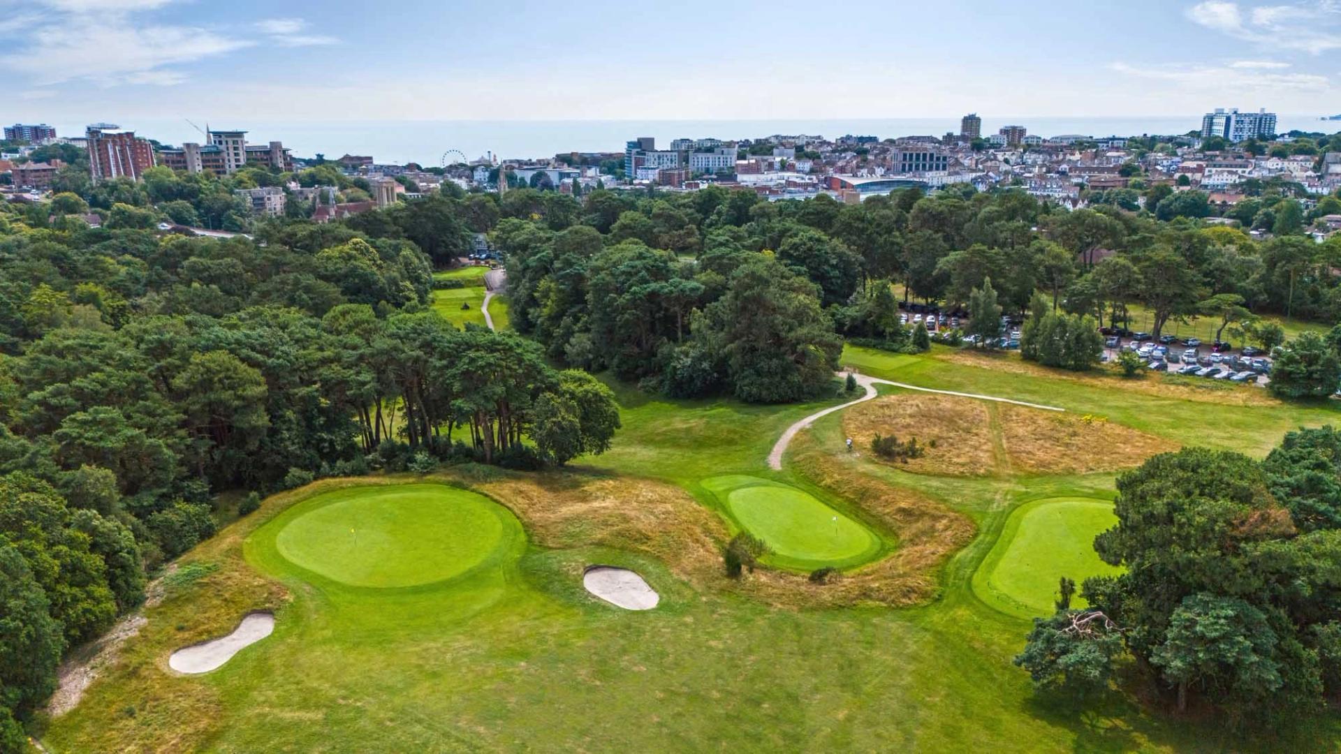 An elevated green next to sand bunkers