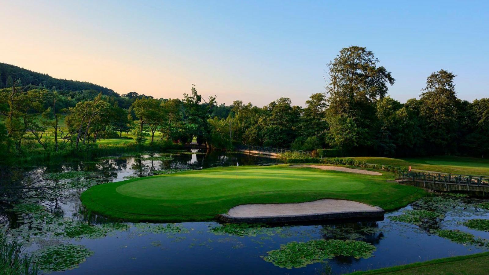 An elevated green with a sand bunker