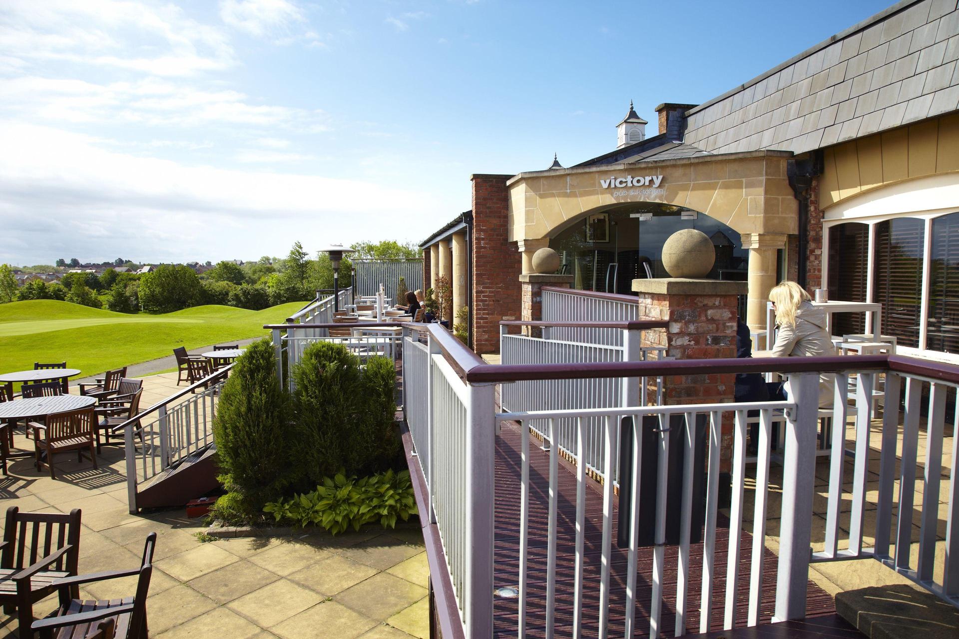 Panoramic view of the Village Hotel Herons Reach clubhouse overlooking the course