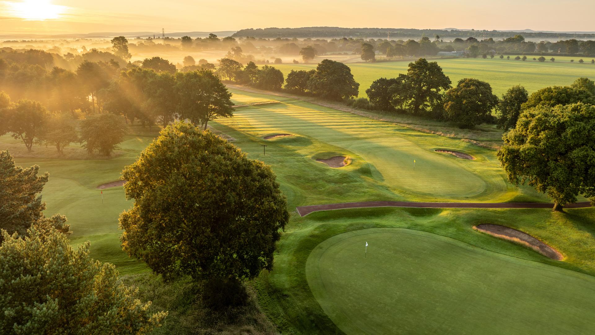 Overhead view of a well maintained fairway leading to a smooth green