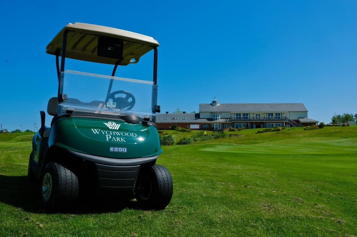 A buggy with the Wychwood Park Hotel logo on the course