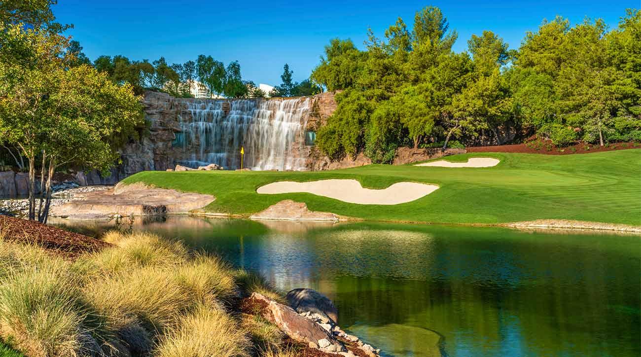 A well maintained fairway nestled with sand bunkers