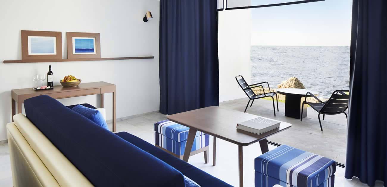 Living room as pat of a suite with a balcony