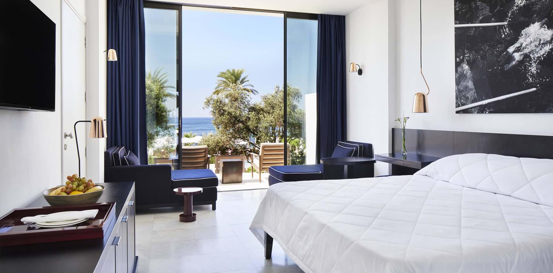 Double bed suite with a patio space and views of the sea