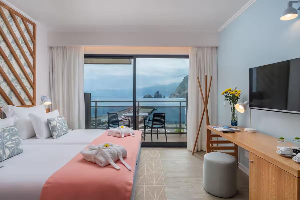 Spacious double bed suite with coastal balcony views at Aqua Natura Bay