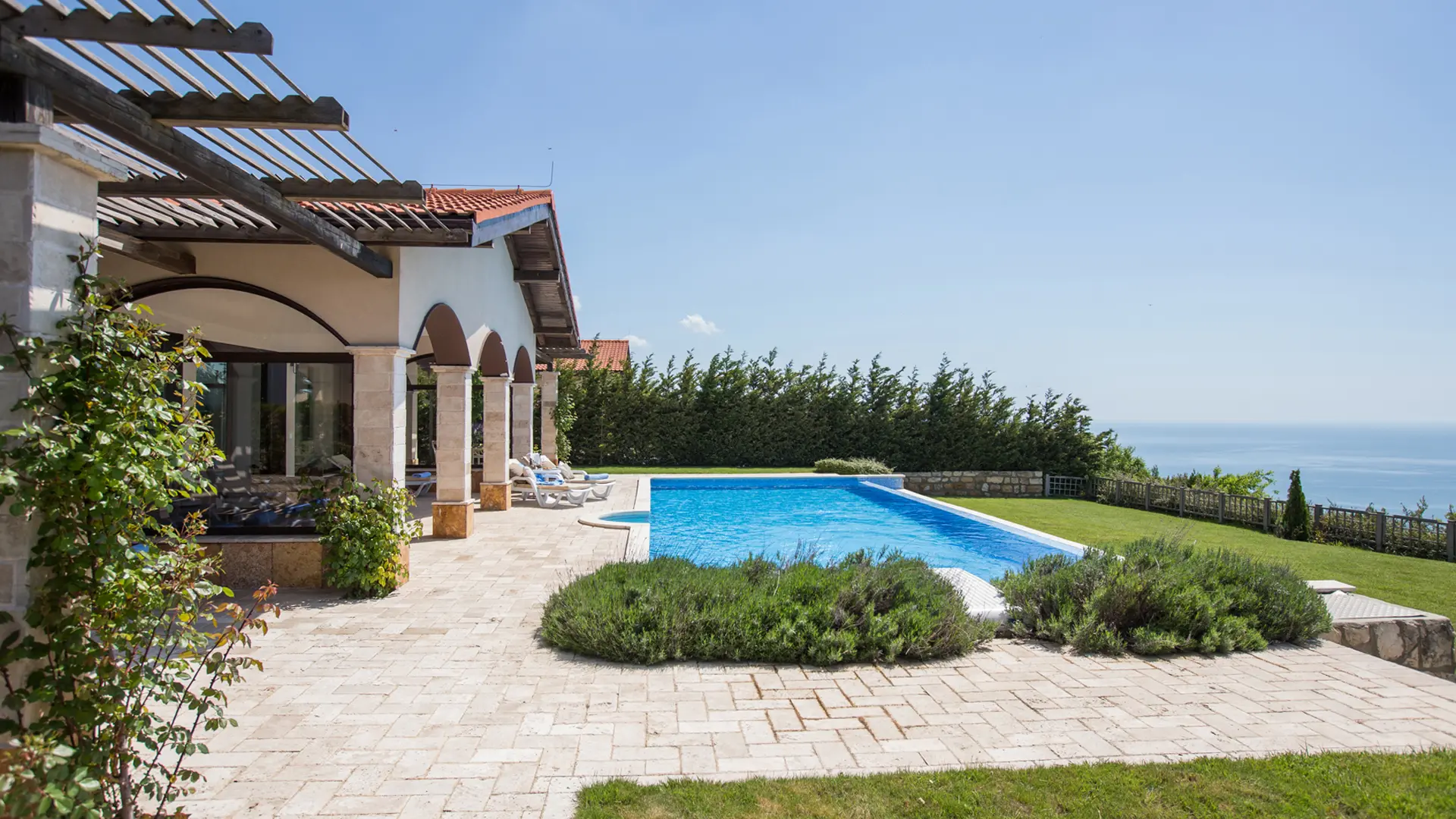 Panoramic view of a villa overlooking the outdoor pool
