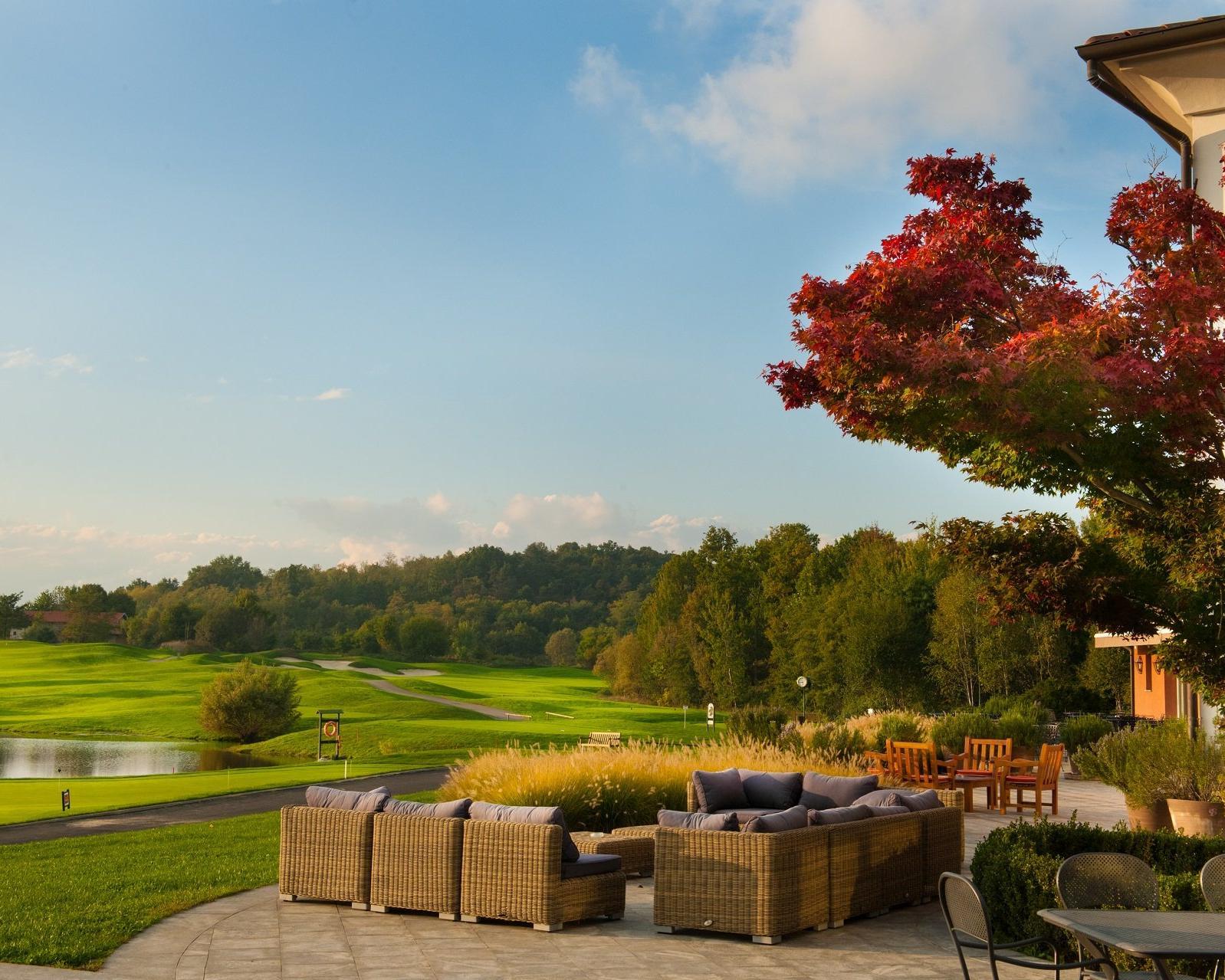 Outdoor lounging area with views of the course at Bogogno Golf Resort