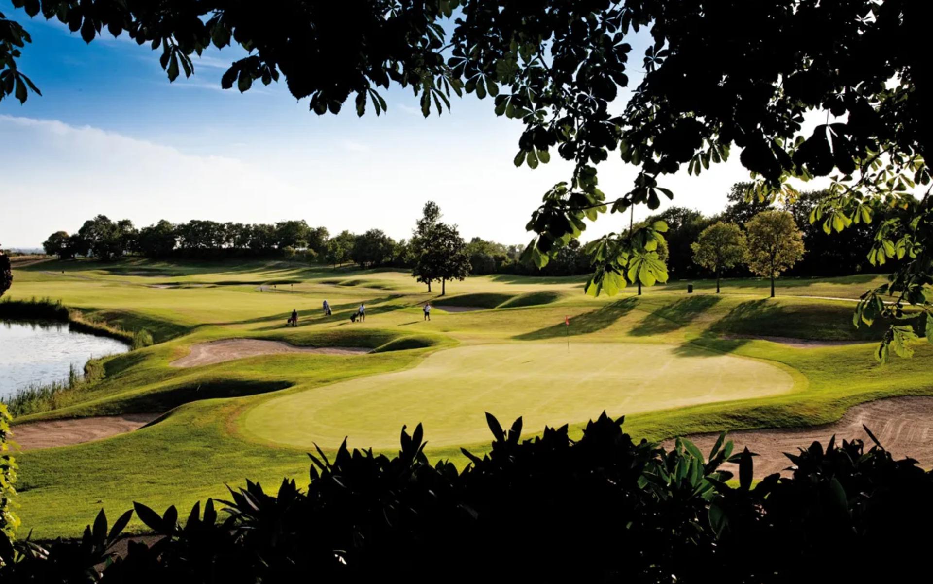A well maintained fairway leading to a smooth green