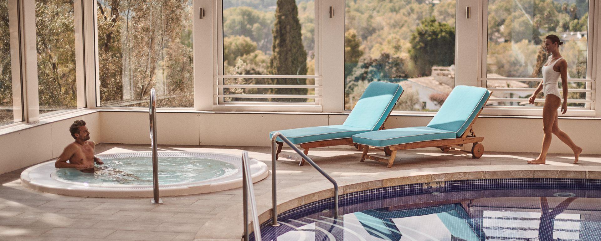 Indoor pool and jacuzzi as part of spa facilities at Castillo Hotel Son Vida