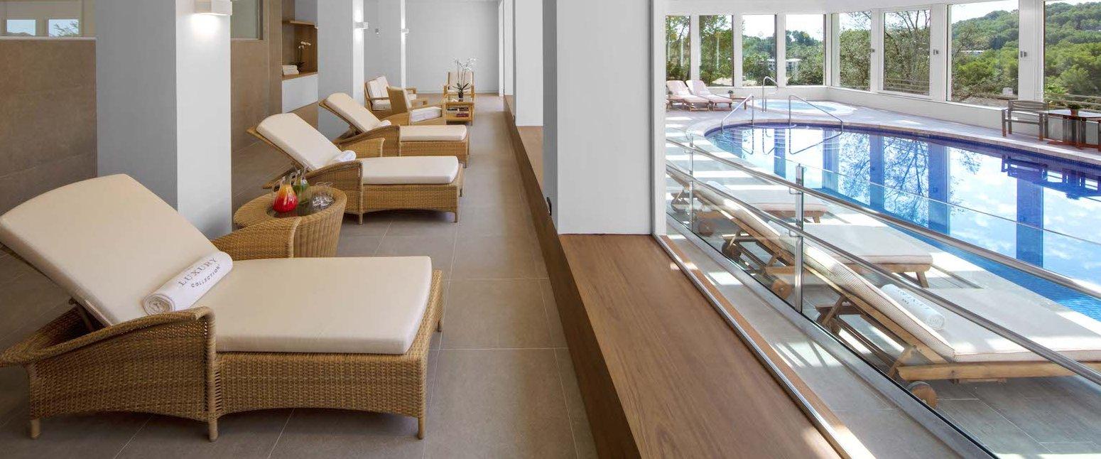 Indoor pool lined with sunbeds