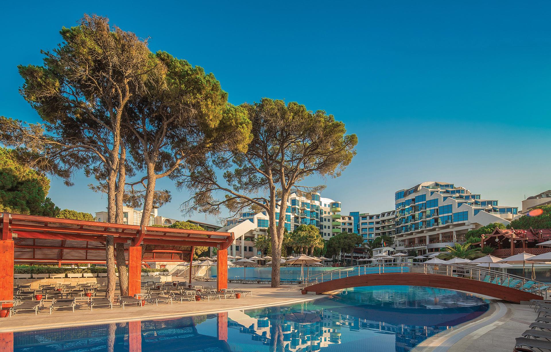 Panoramic view of the Cornelia Deluxe Resort building overlooking the outdoor pool