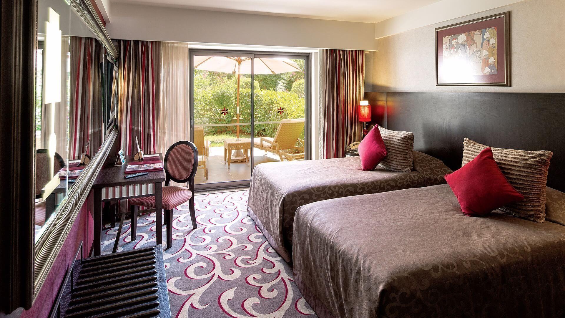 Twin bed suite with balcony views at Cornelia Deluxe Resort