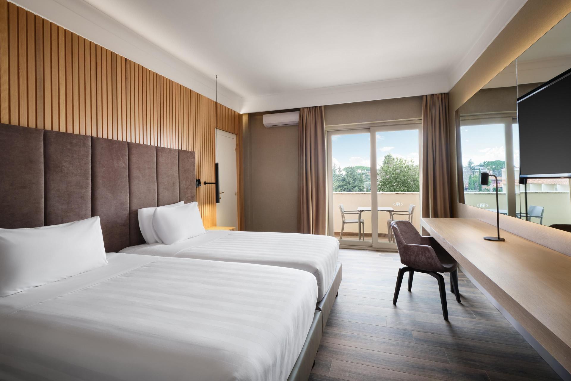 Twin bed suite with balcony views at at Crowne Plaza Rome