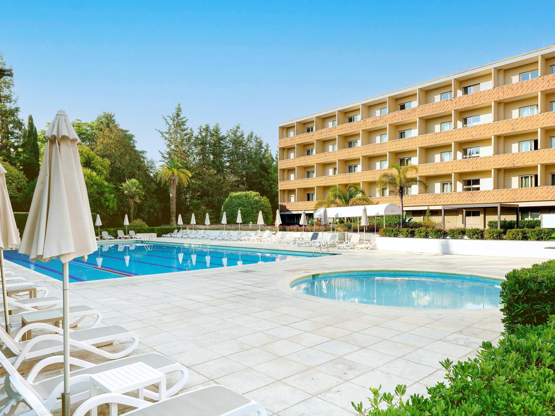 Panoramic view of Crowne Plaza Rome overlooking the outdoor pool