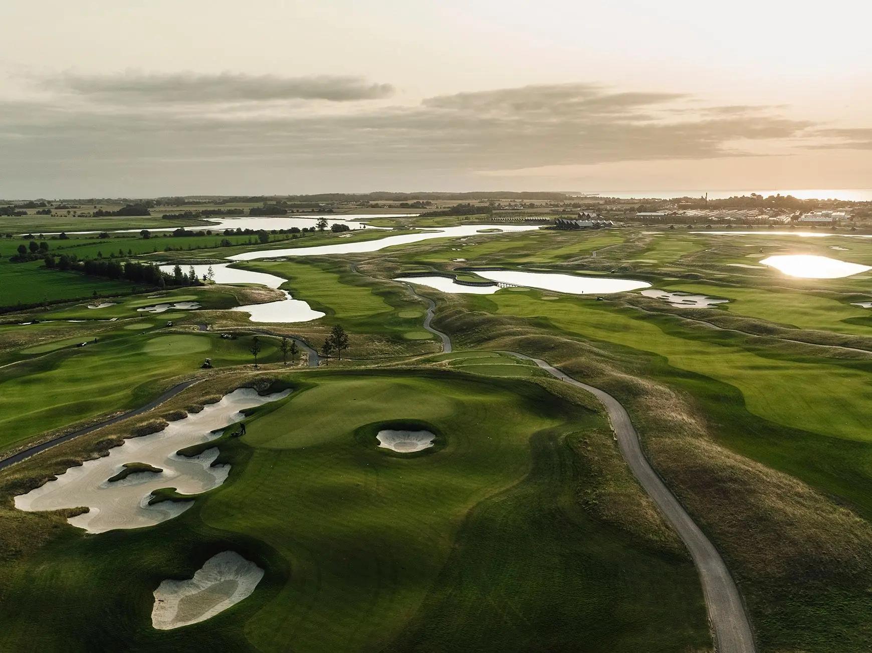 Aerial view of the sun setting over the Great Northern course