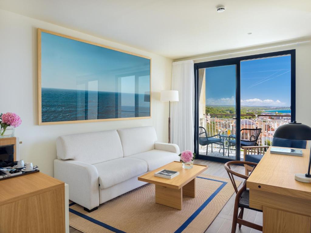 Lounge area of a suite with a balcony