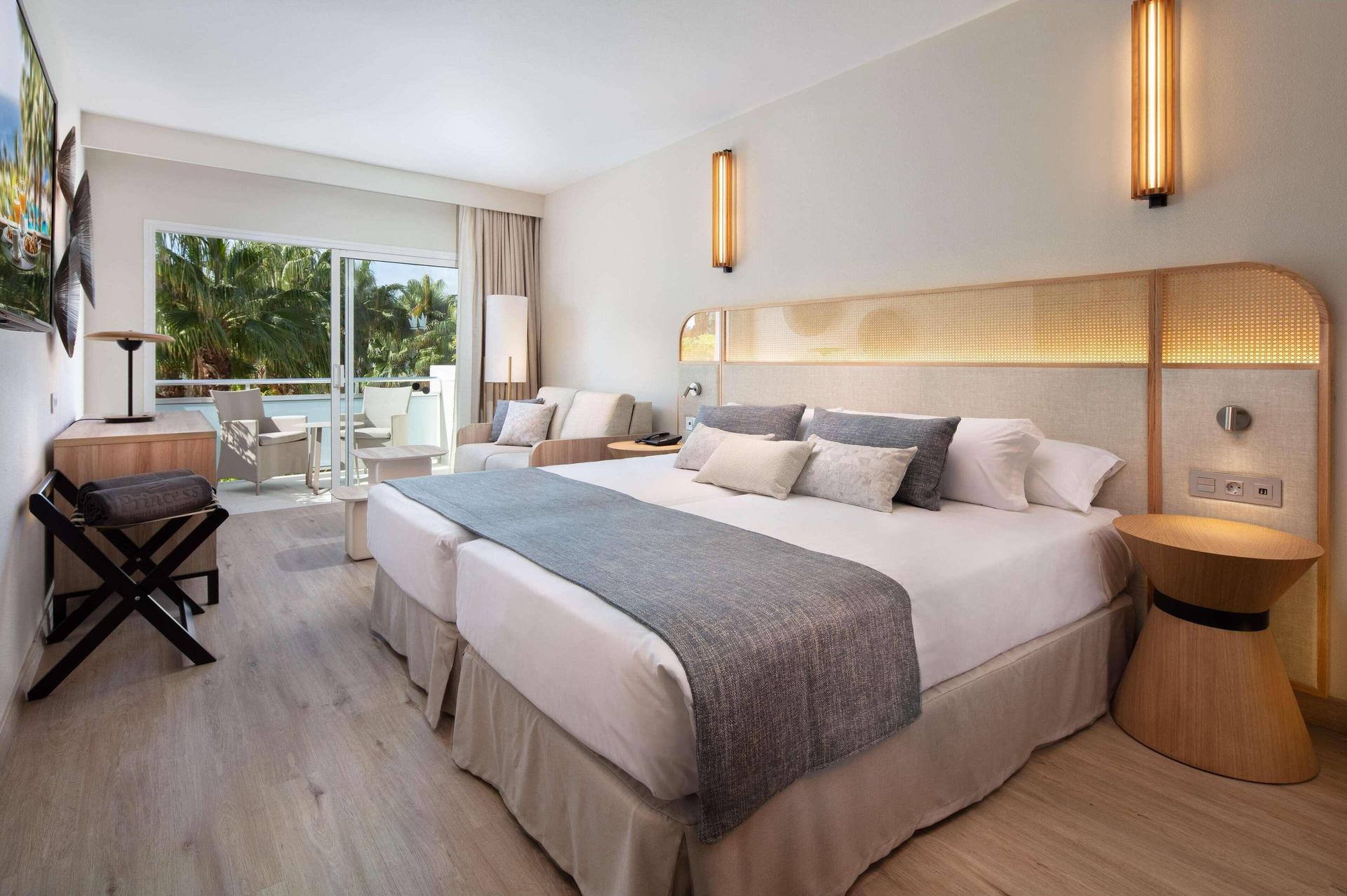 Spacious double bed suite with patio space at Hotel Tabaiba Princess