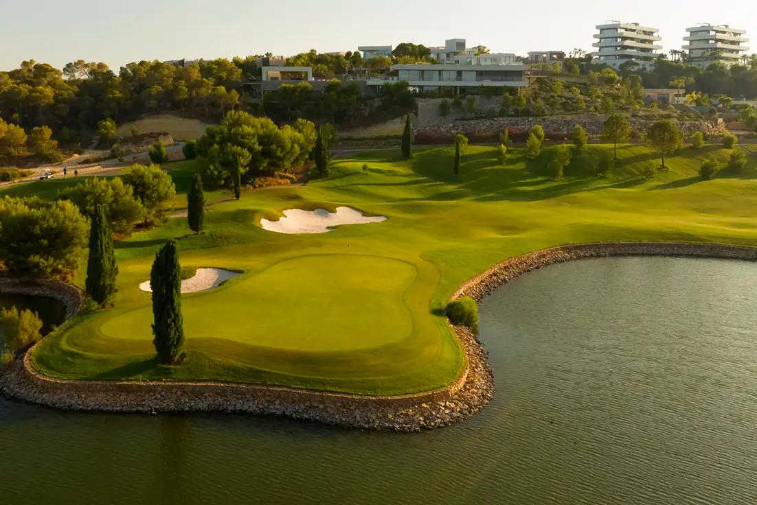 A well maintained fairway nestled with sand bunkers at Las Colinas Residences