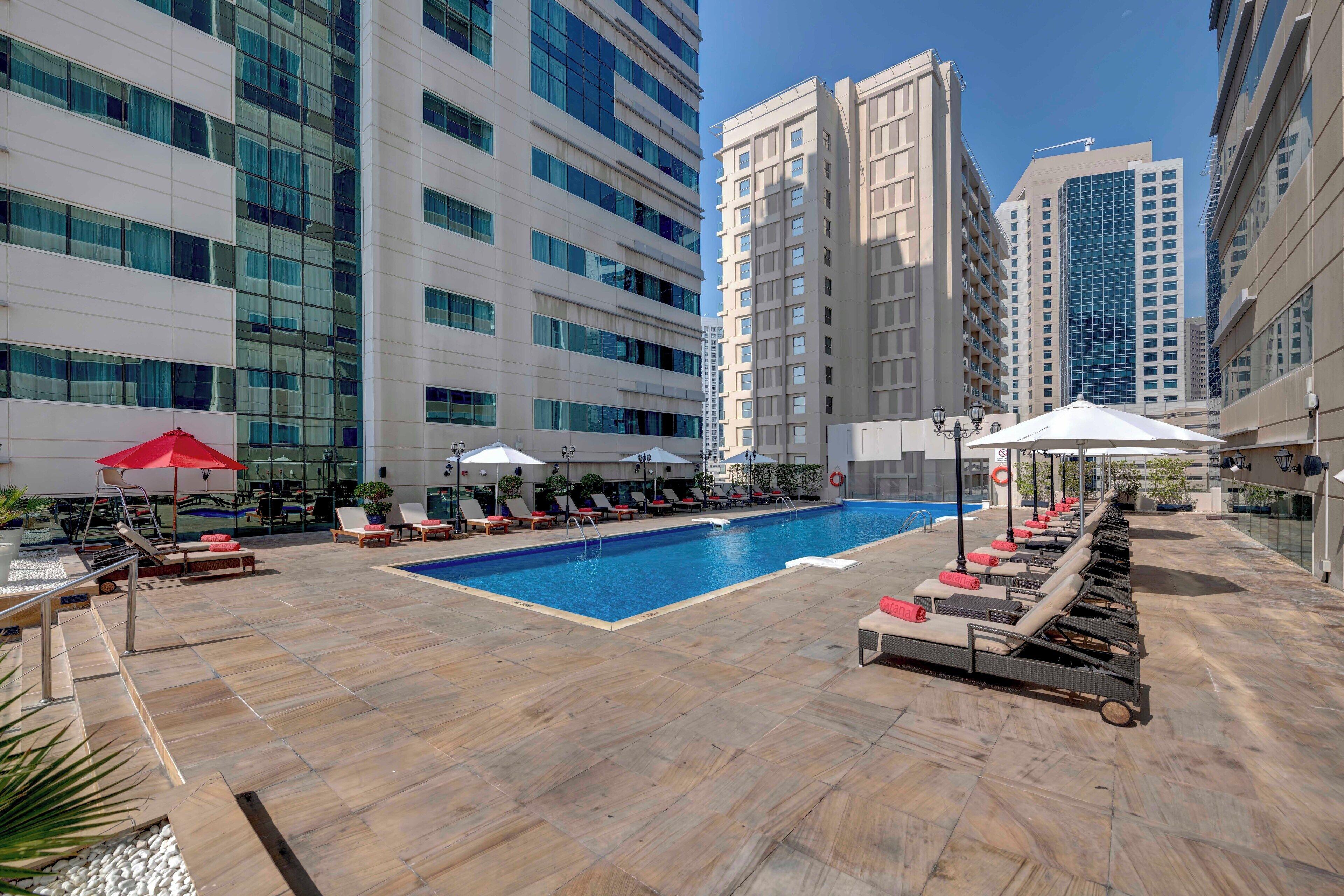 Panoramic view of the outdoor swimming pool at Media Rotana Dubai