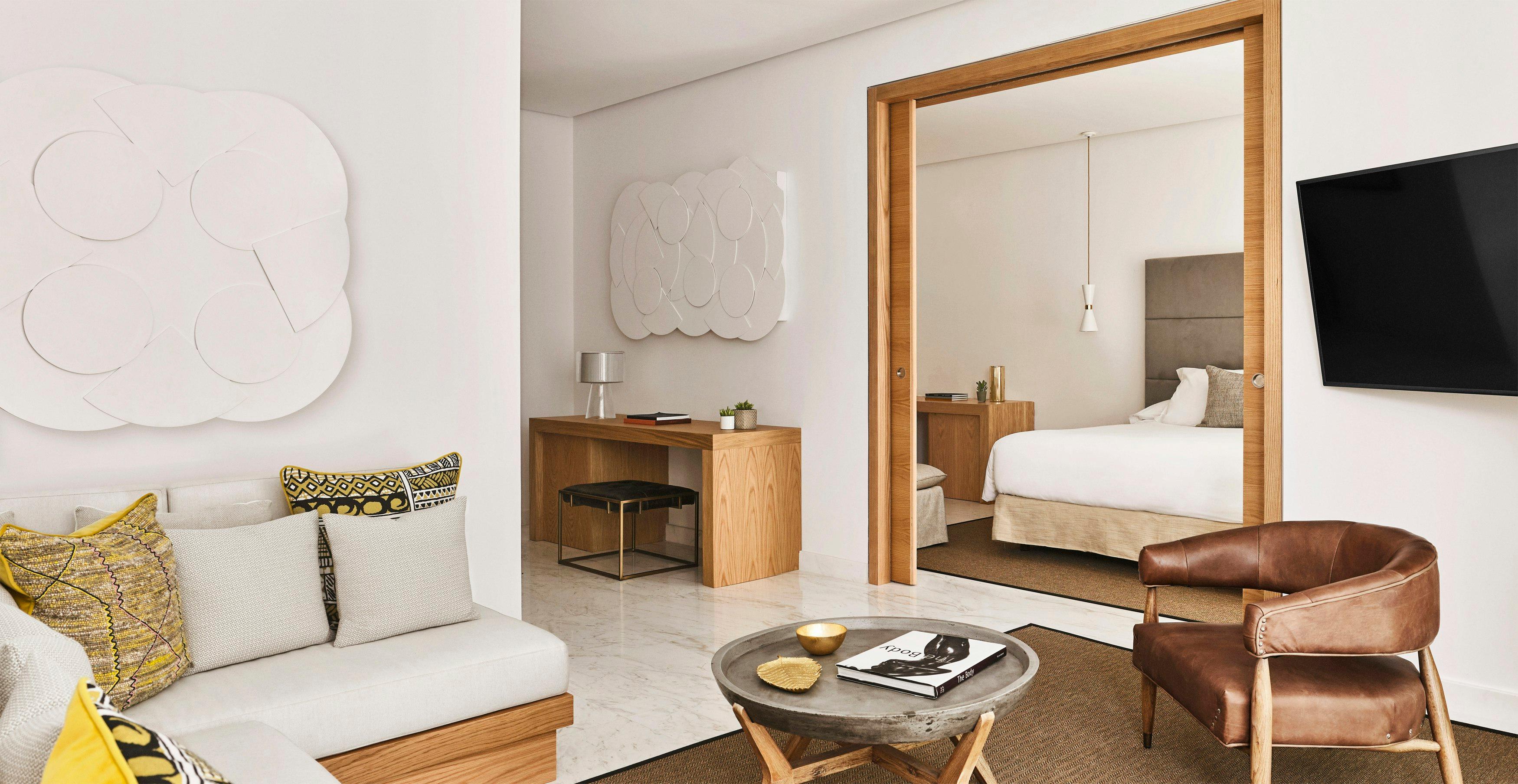 Double bed suite with a separate living room at Nobu Hotel Marbella