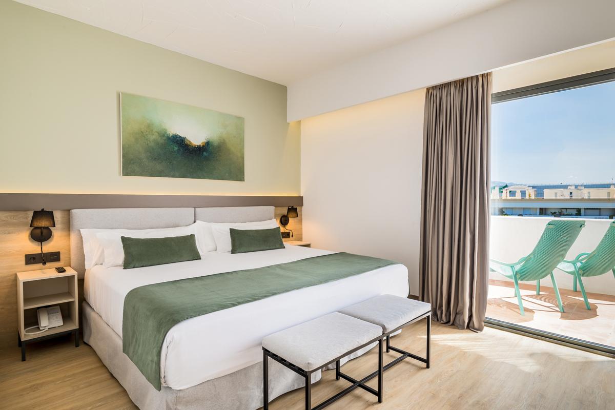 Double bed suite with balcony views at Occidental Puerto Banus