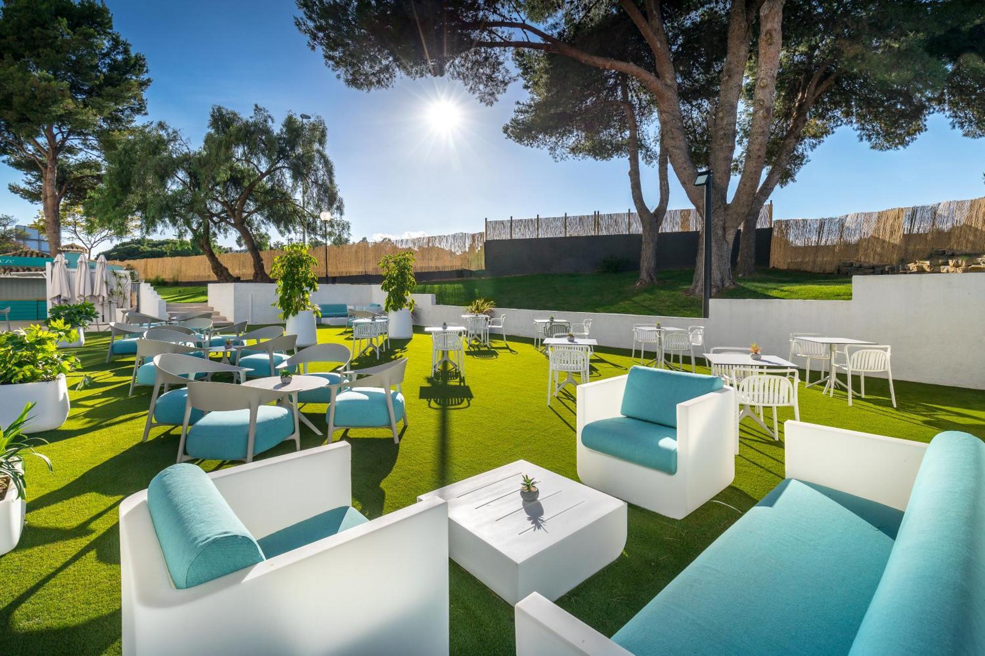 Sun shining down on an outdoor lounging area at Occidental Puerto Banus