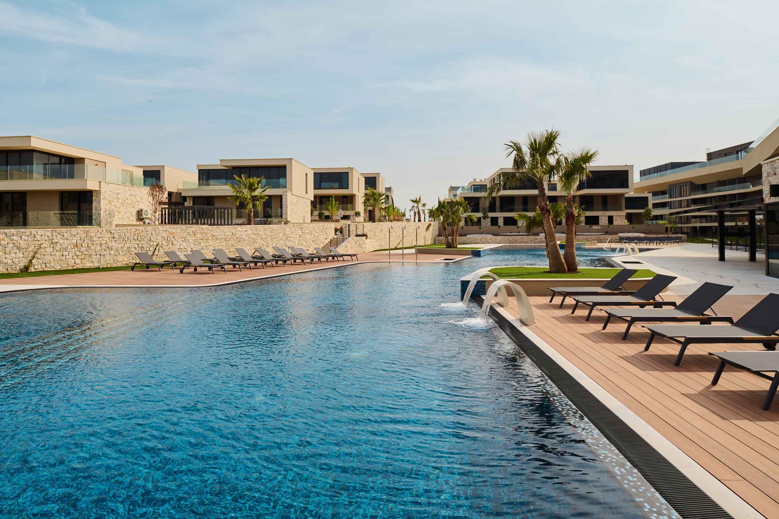 Outdoor swimming pool at Petram Resort & Residences