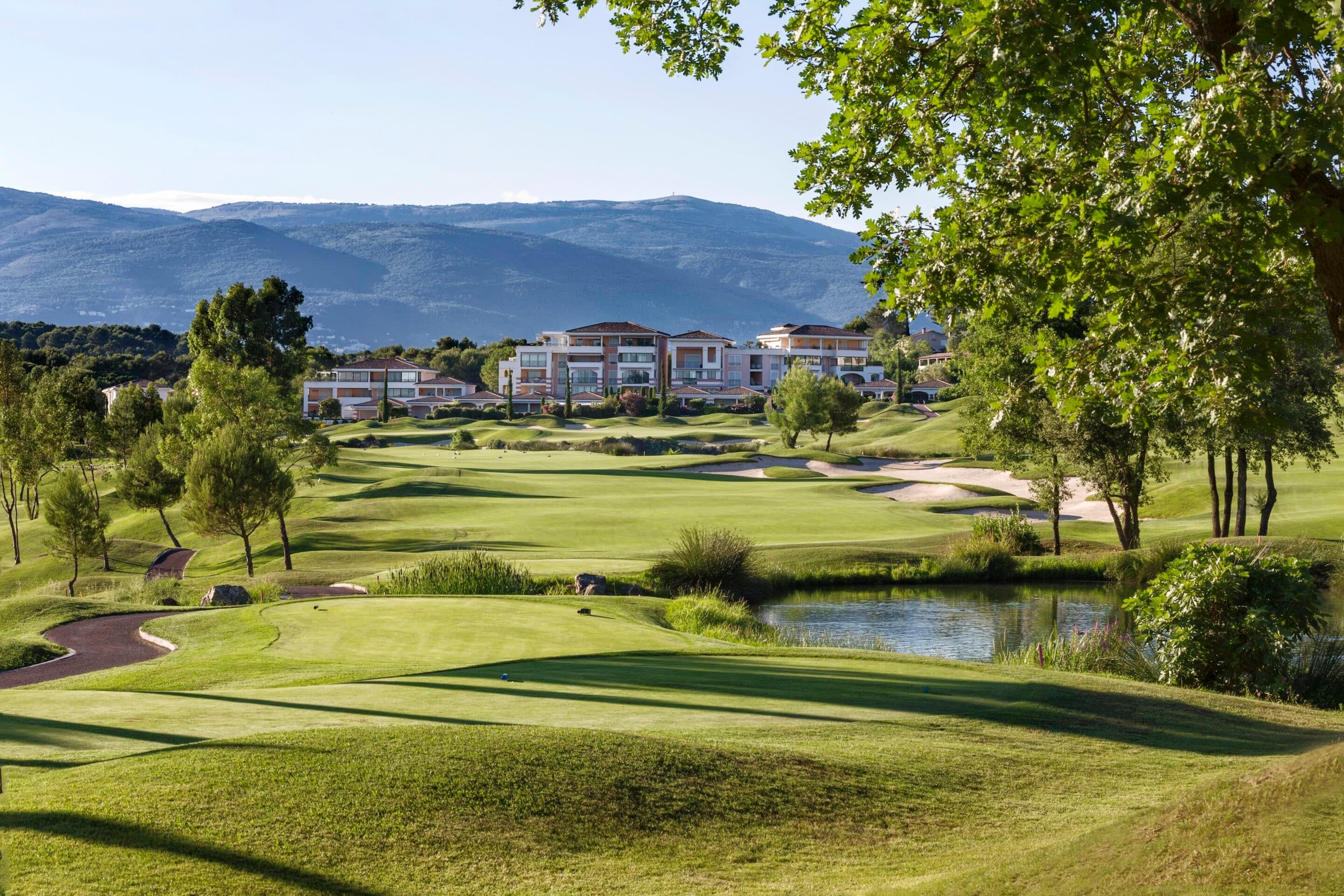 A well maintained fairway with a water hazard at Royal Mougins Golf & Resort