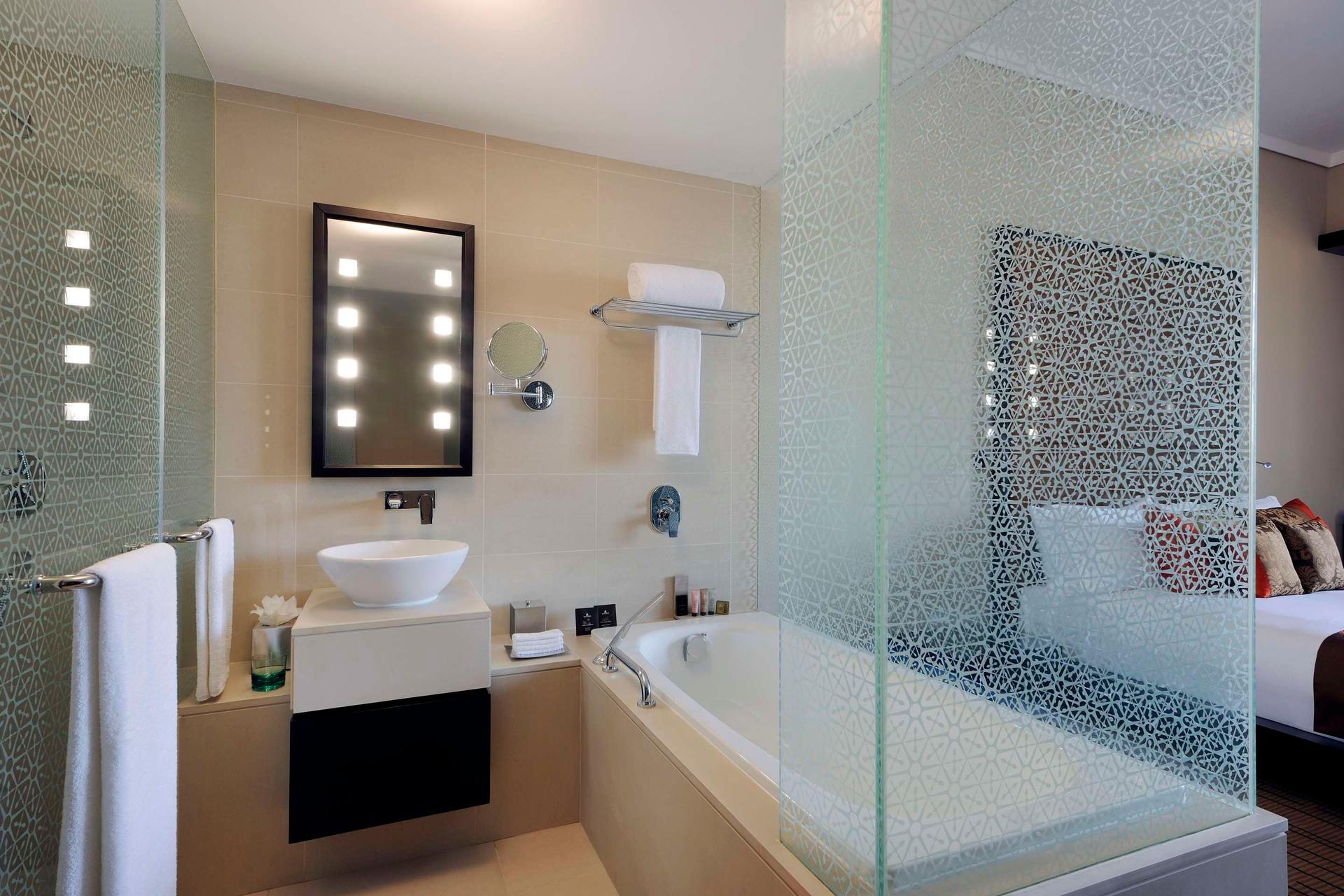Open plan bathroom as part of a double bed suite at Southern Sun - Abu Dhabi
