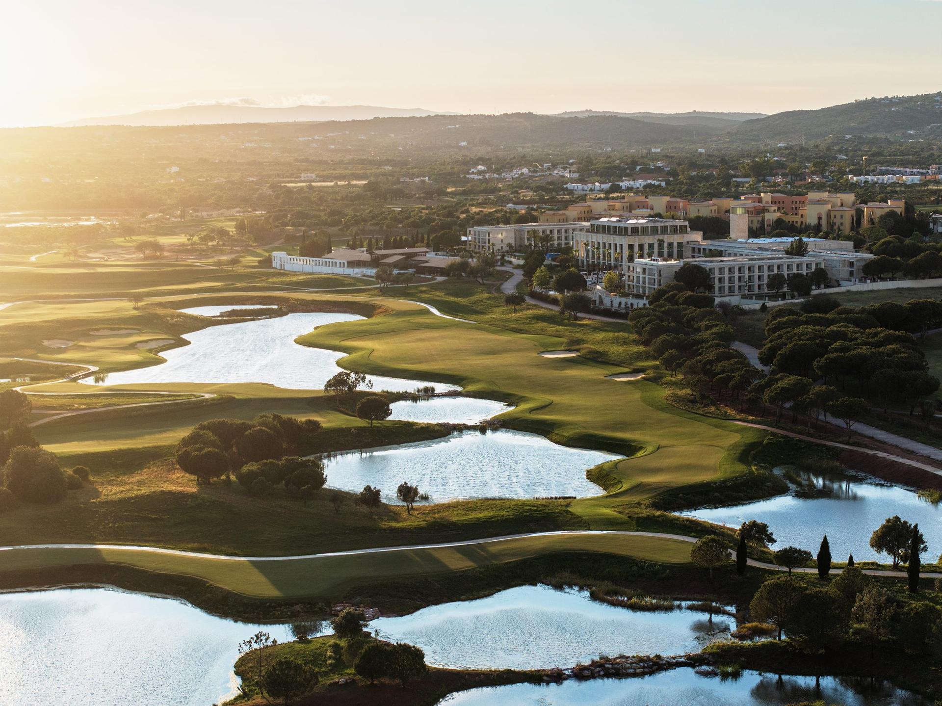 Aerial view of well maintained fairways with water hazards