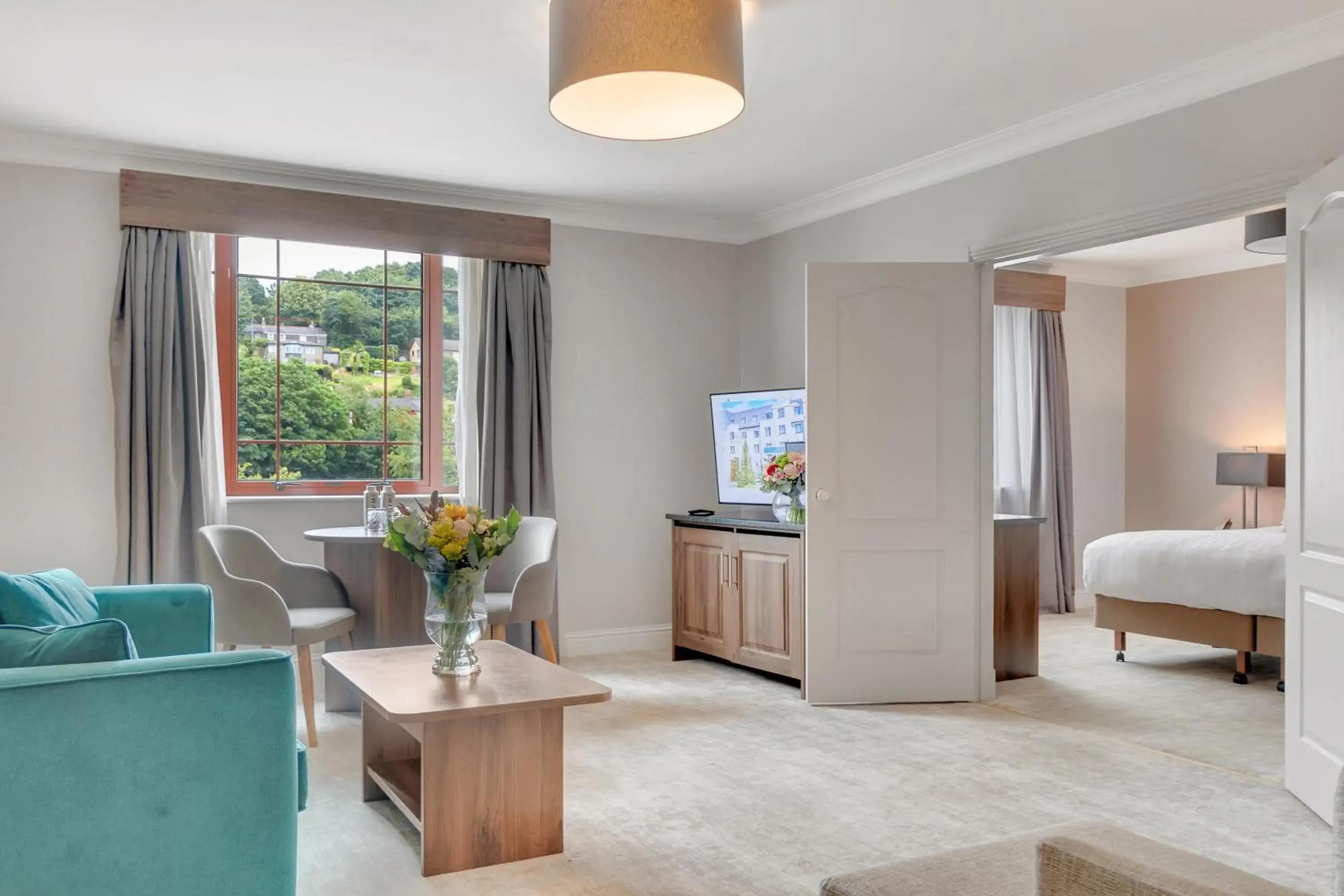 Spacious double bed suite at The Kingsley Hotel with a separate living room space