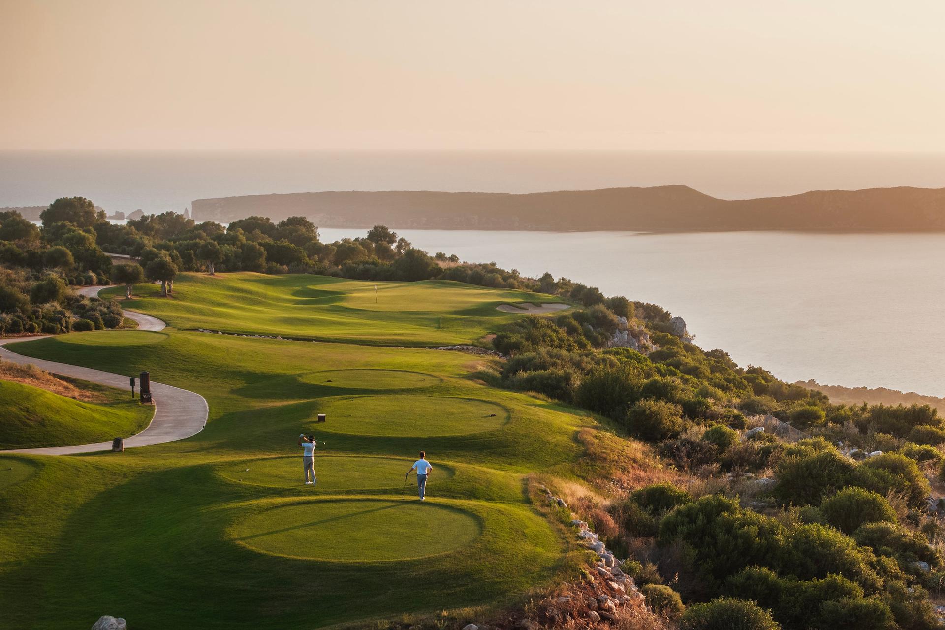 Overhead view of a tee box leading to a coastal fairway at Costa Navarino